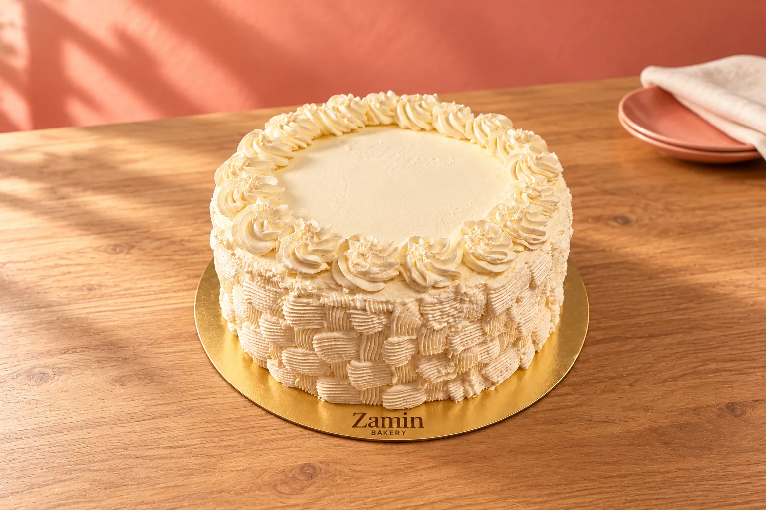 Round basketweave cake on a Zamin Bakery gold board